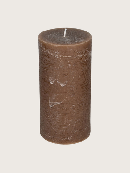 Brown candle on a white background