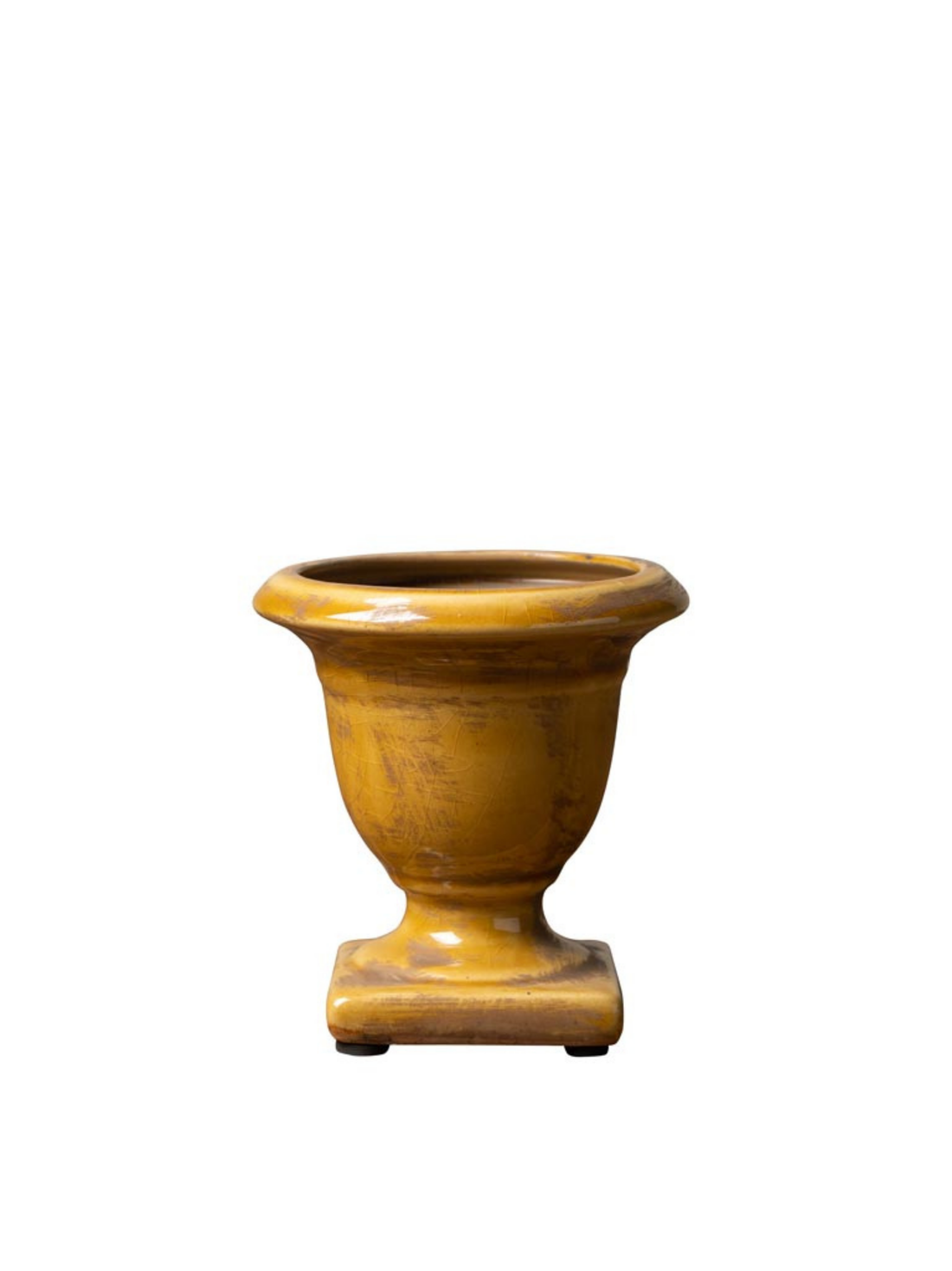 mustard ceramic urn on a white background