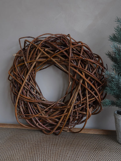 Woven branch wreath on a neutral background