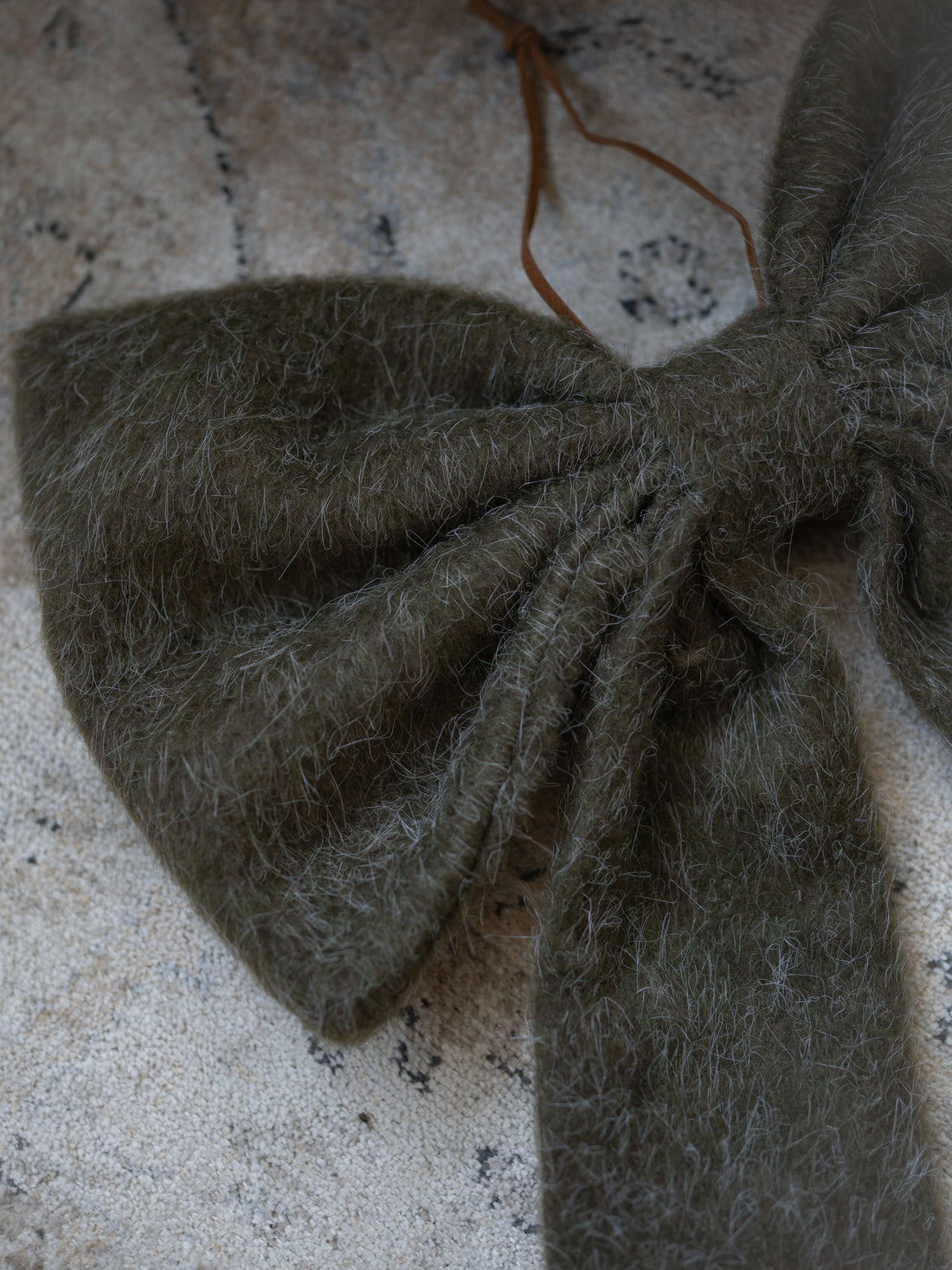 Up close of olive green bow