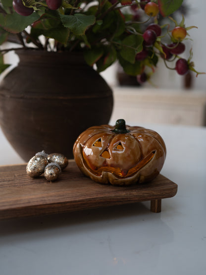 autumn led pumpkin ornament on wooden styling tray