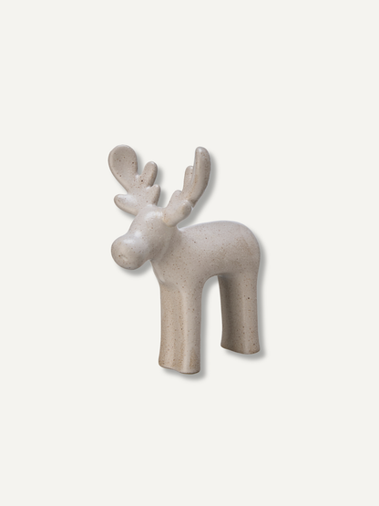A minimalist ceramic deer figurine in a speckled light beige finish, shown against a solid off-white background.