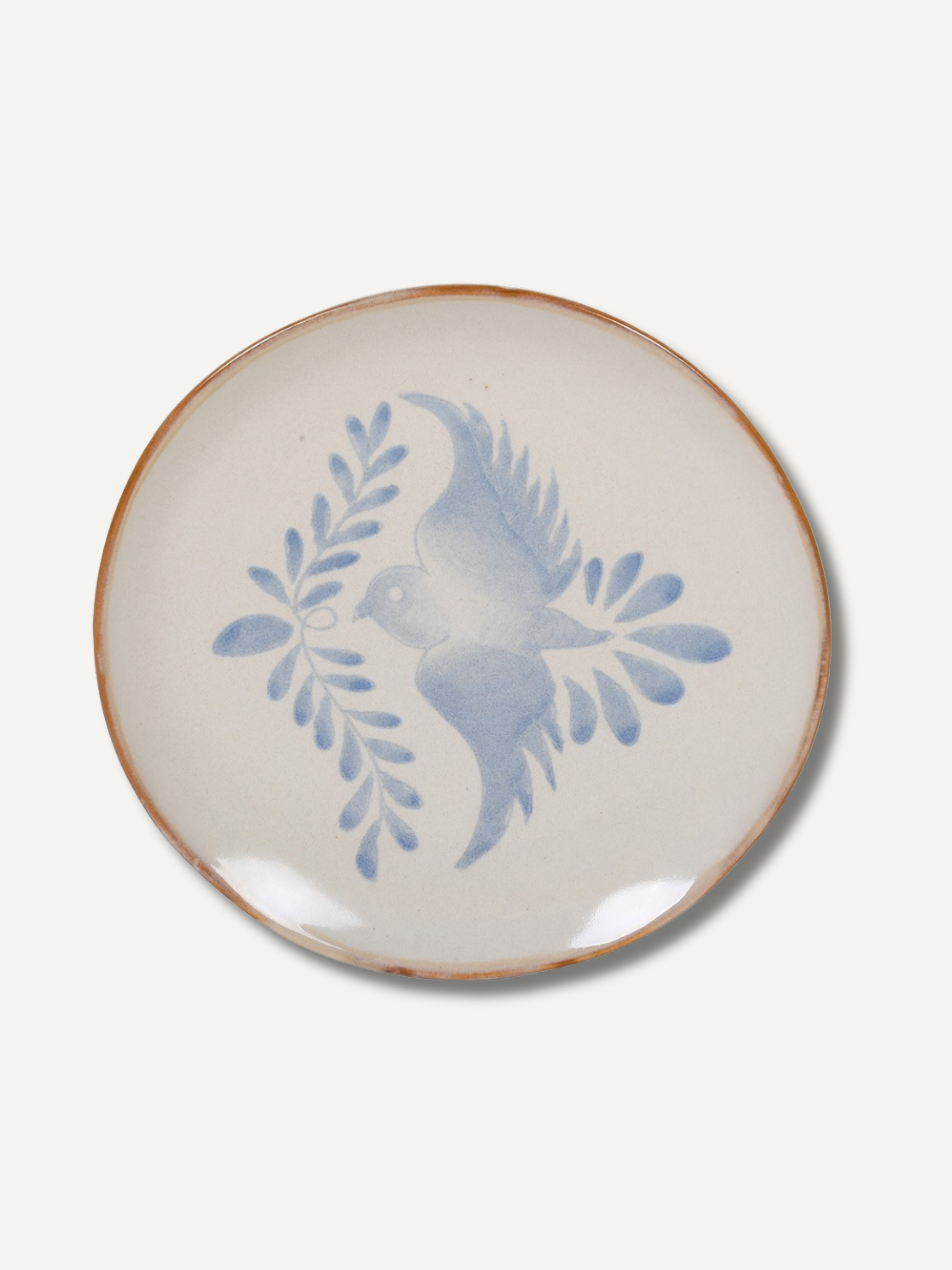 Ceramic plate with blue bird design on a white background