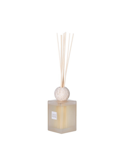 Square diffuser with spherical cap and reeds on a white background