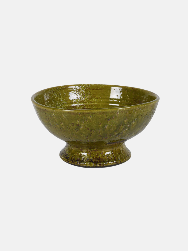 Green ceramic bowl on a white background
