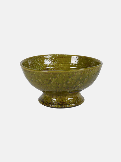 Green ceramic bowl on a white background