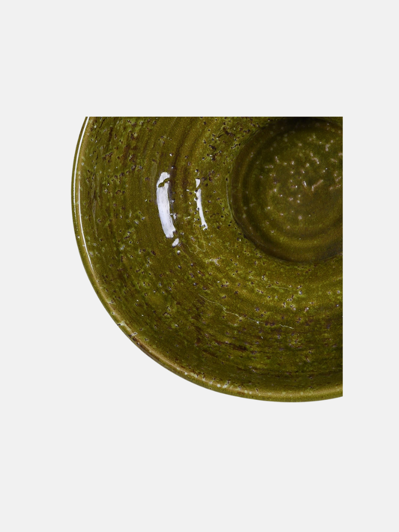 Green ceramic plate on a white background
