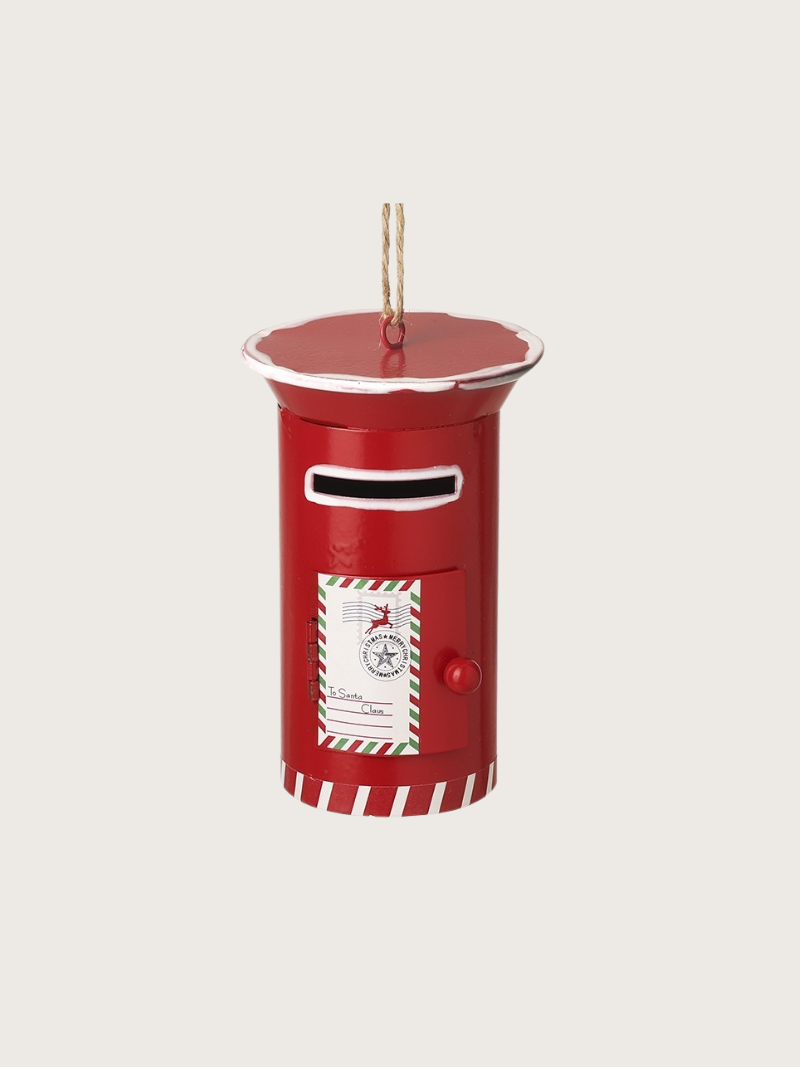 Red postbox-shaped ornament with a white label on a beige background