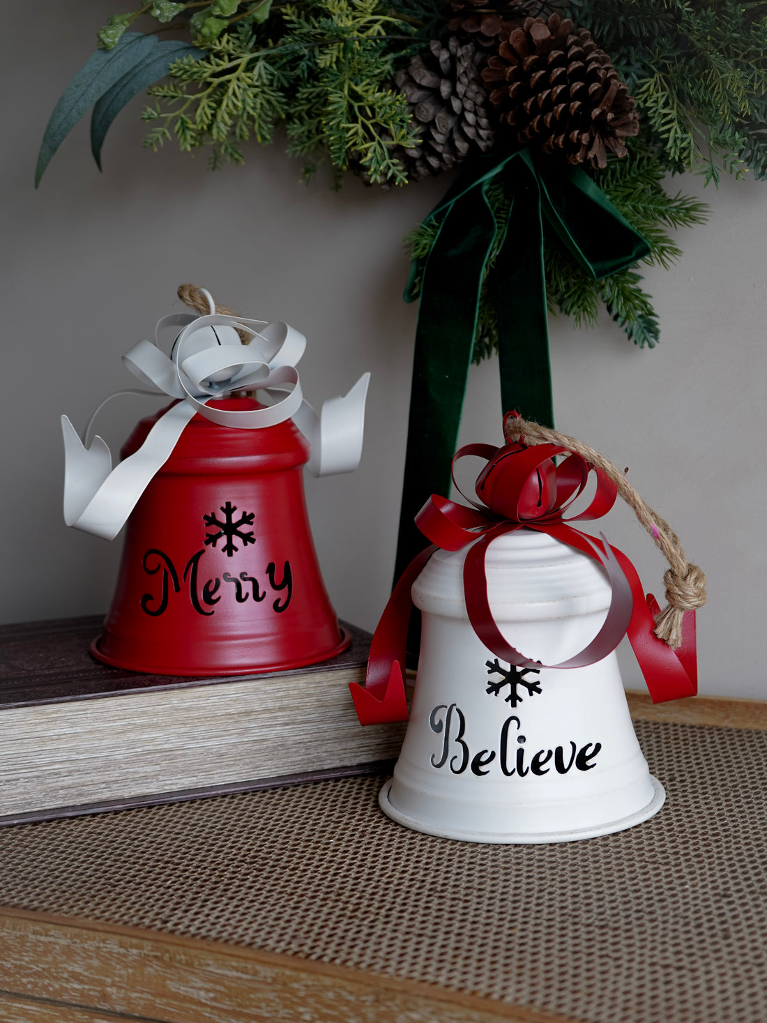 Two decorative bells with &