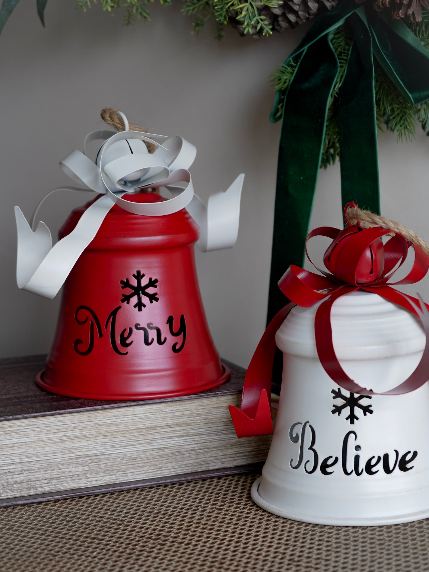 Two decorative ceramic bells with &