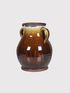 Brown ceramic amphora vase with two handles on a light gray background
