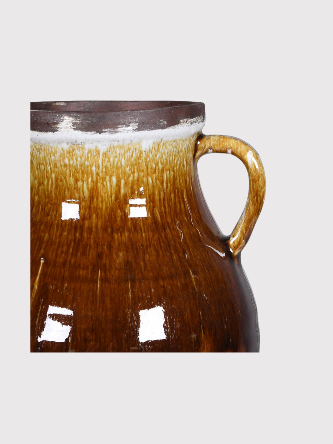 Brown ceramic amphora vase with handle on a white background