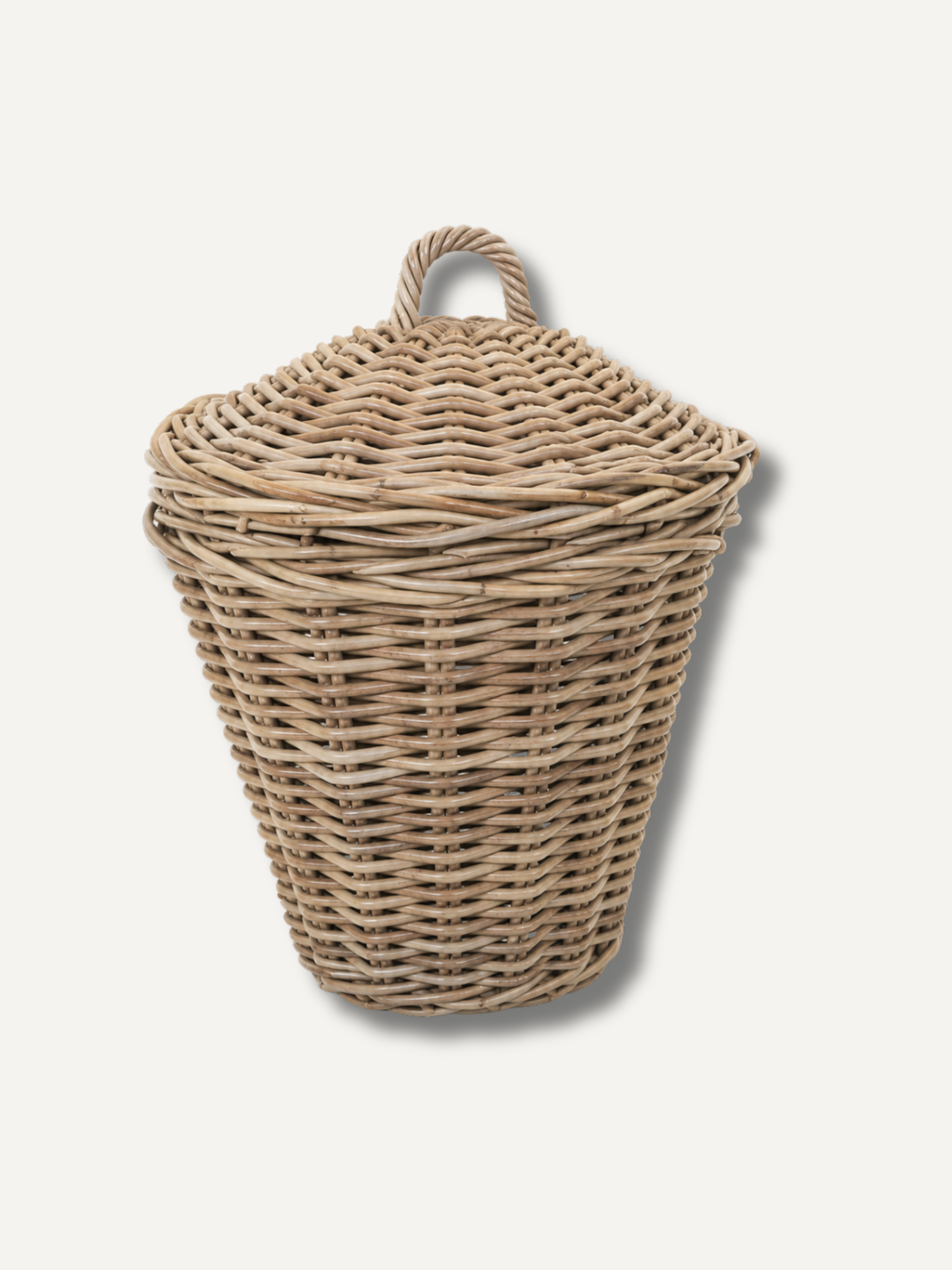 Wicker laundry basket with a lid on a white background