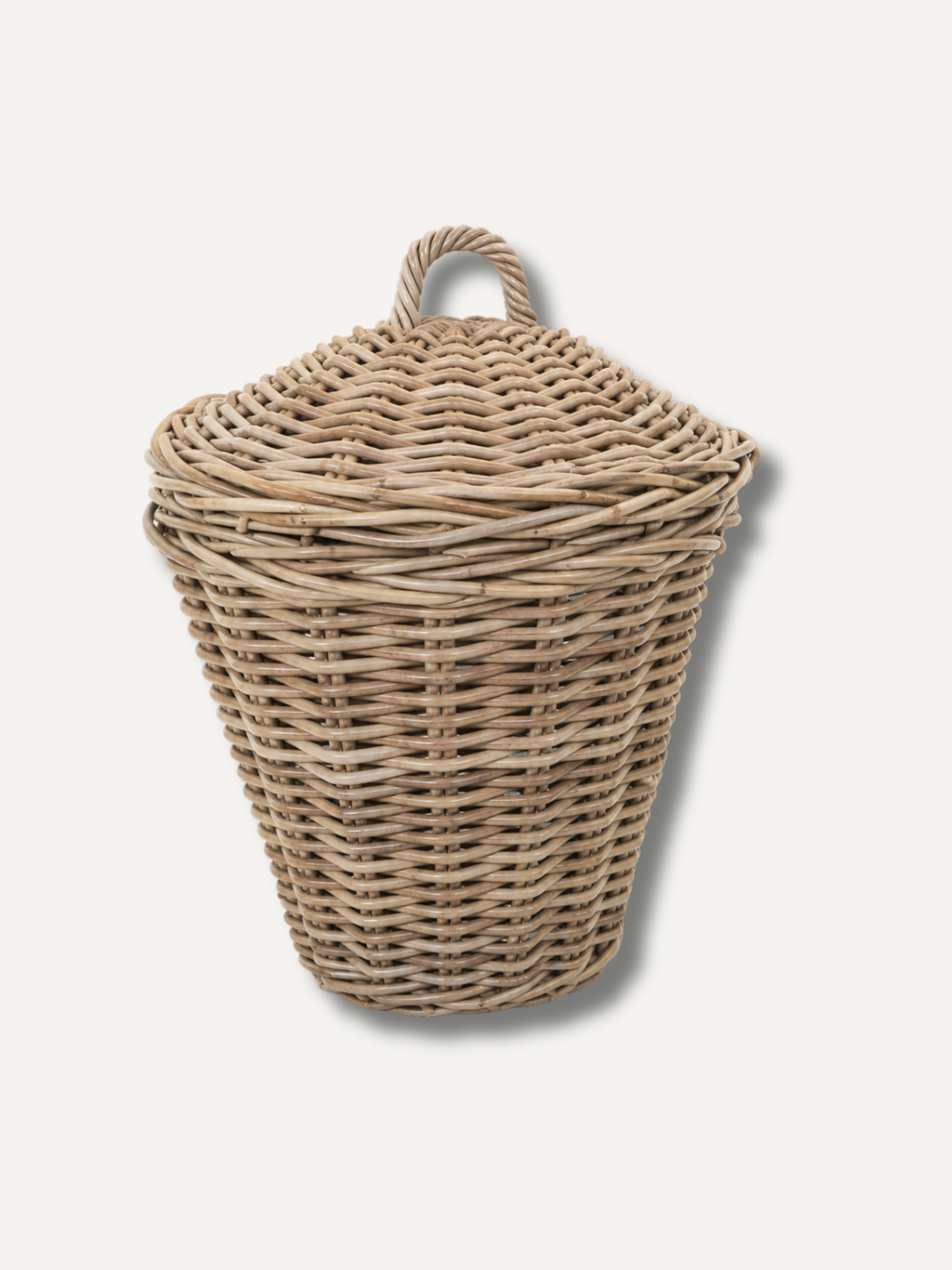 Wicker laundry basket with a lid on a white background