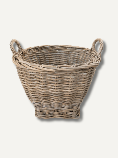 Woven basket with handles on a white background