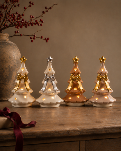 Large Sugar Plum Ceramic Trees on wooden sideboard with vase filled with faux red berries in the background