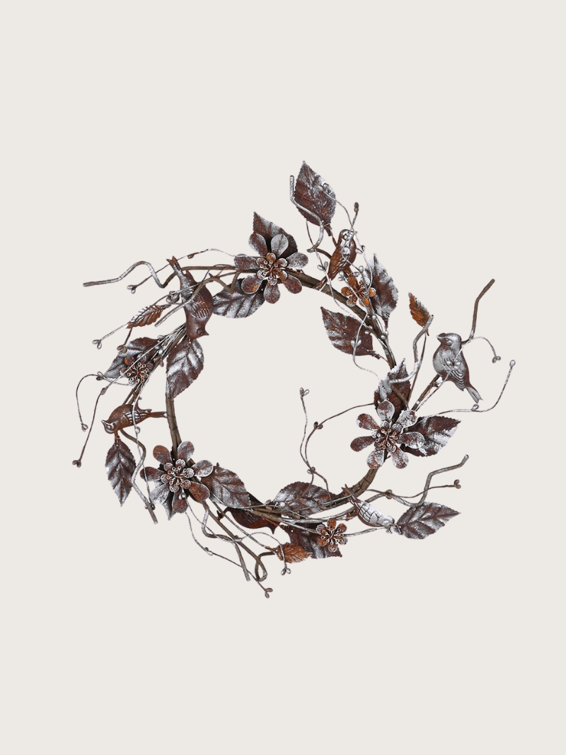 Decorative wreath with floral and bird designs on a light background