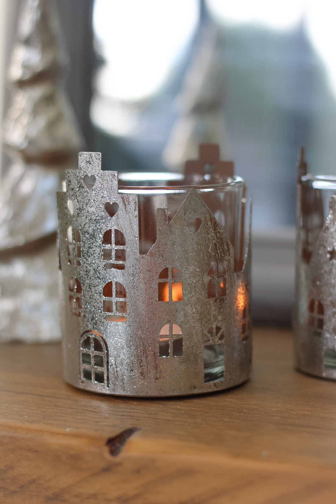 Beautiful glass candle holder with festive winter village scene perfect for christmas decor 
