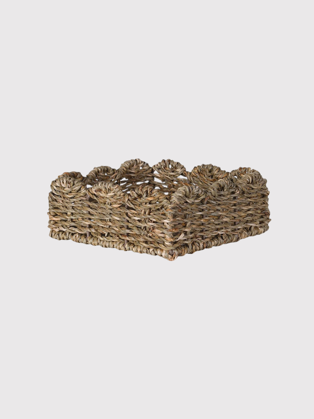 Woven napkin holder basket on a light gray background
