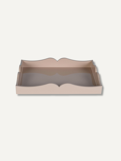 A rectangular tray with scalloped edges in a muted dusty pink color, shown from a top-down perspective on a light off-white background.
