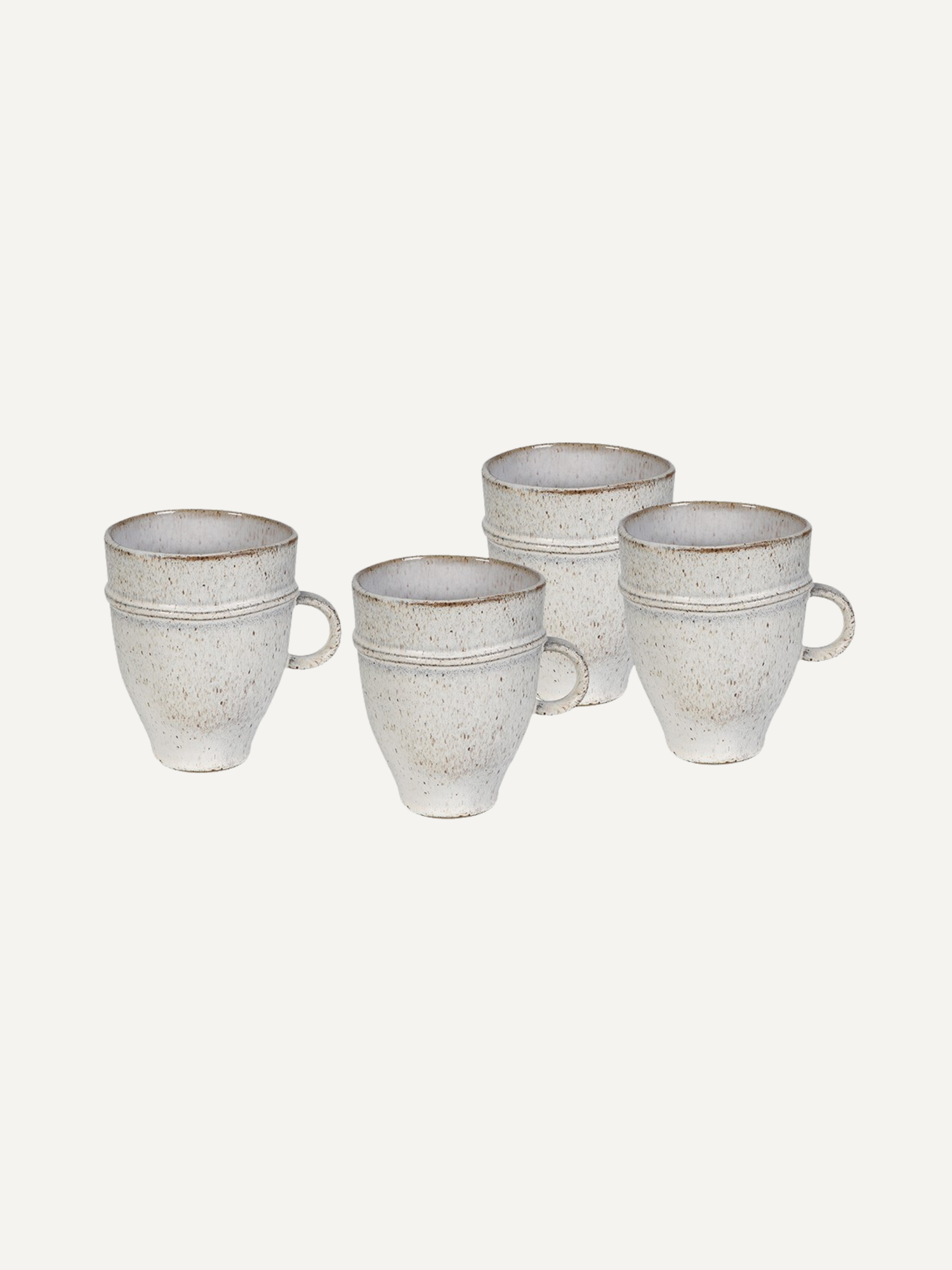 Set of four ceramic mugs with a textured finish on a white background