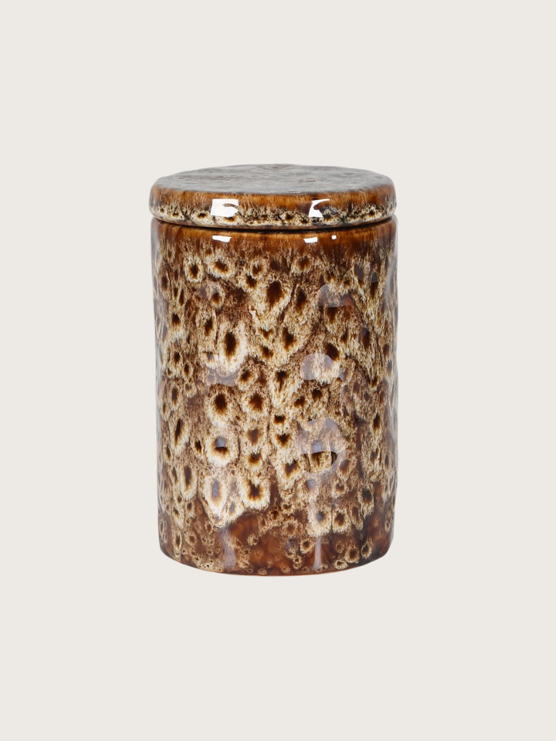 Ceramic jar with a textured brown glaze on a light gray background