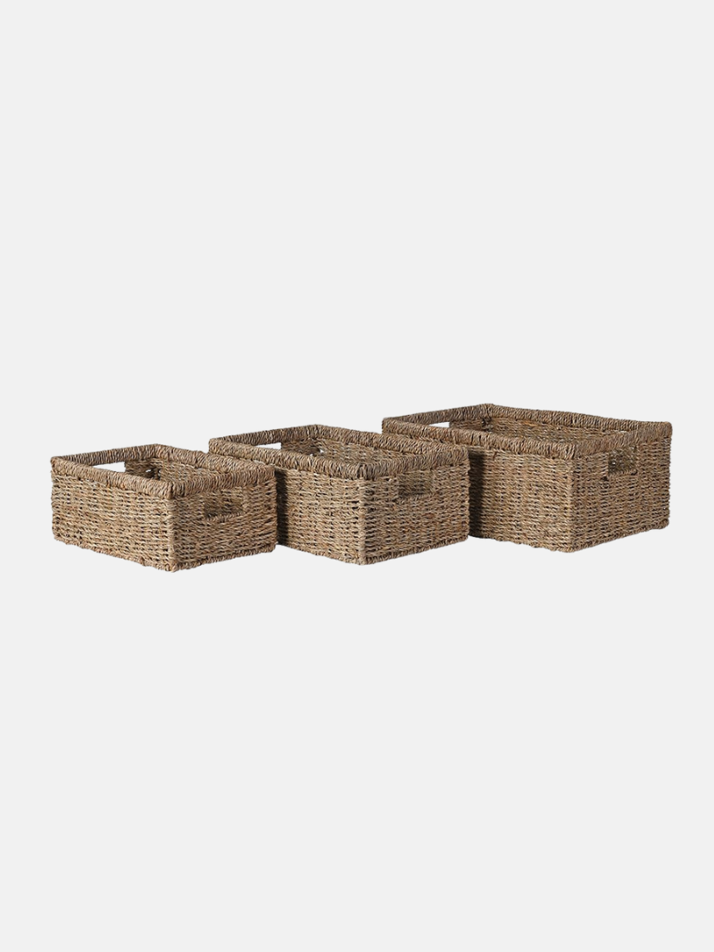 Three woven storage baskets on a white background
