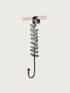 Decorative leaf-patterned wreath hanger hook on a white background