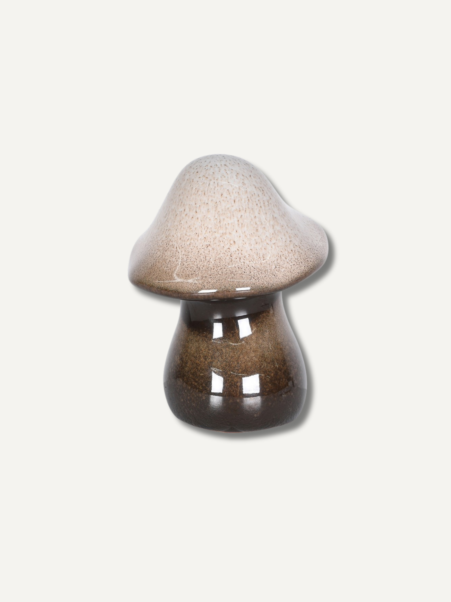 Small stoneware glazed brown mushroom ornament with warm brown glaze