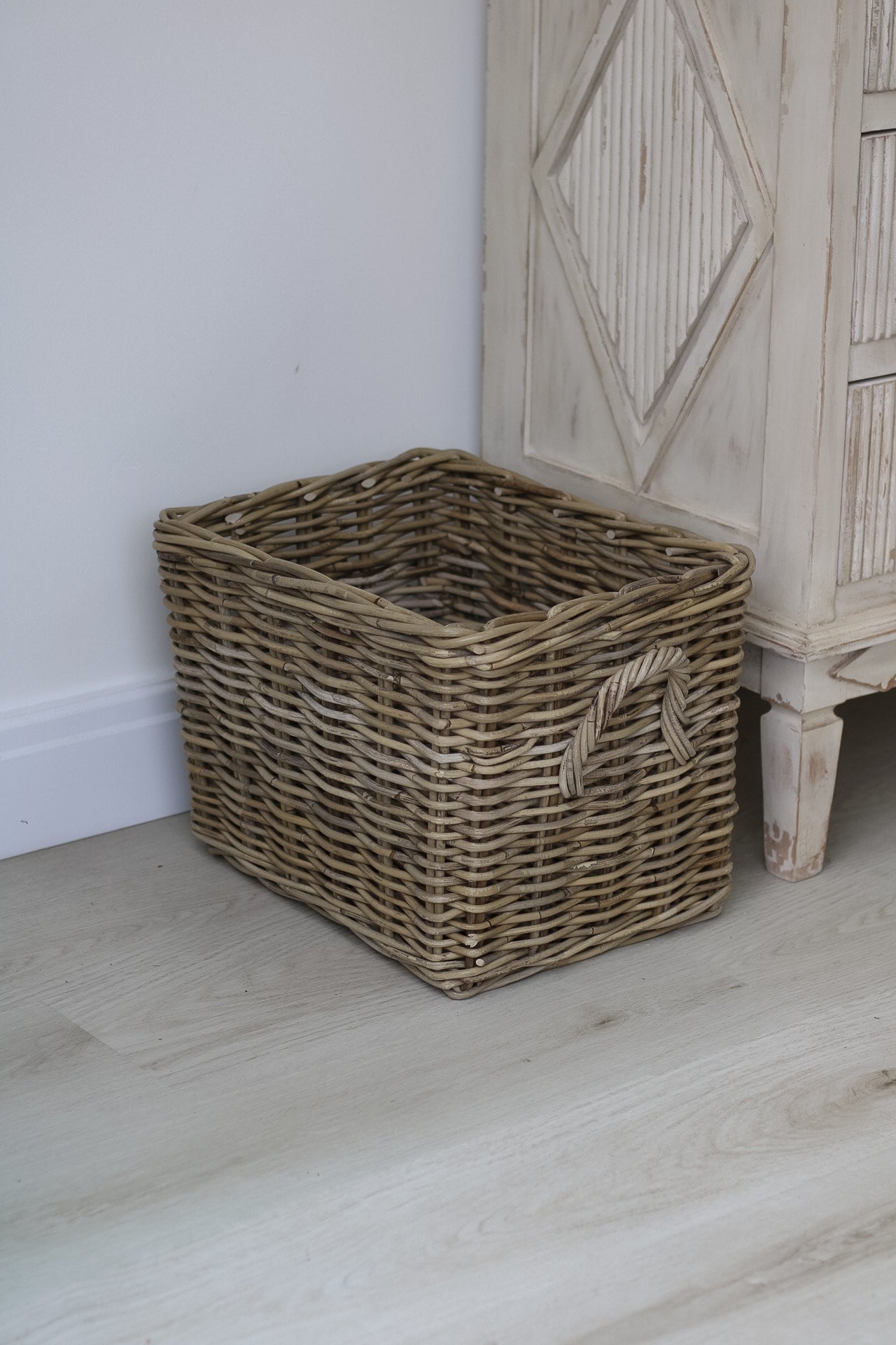 Small wicker basket perfect for log storage by your fireplace in your home decor