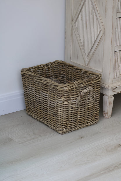 Small wicker basket perfect for log storage by your fireplace in your home decor