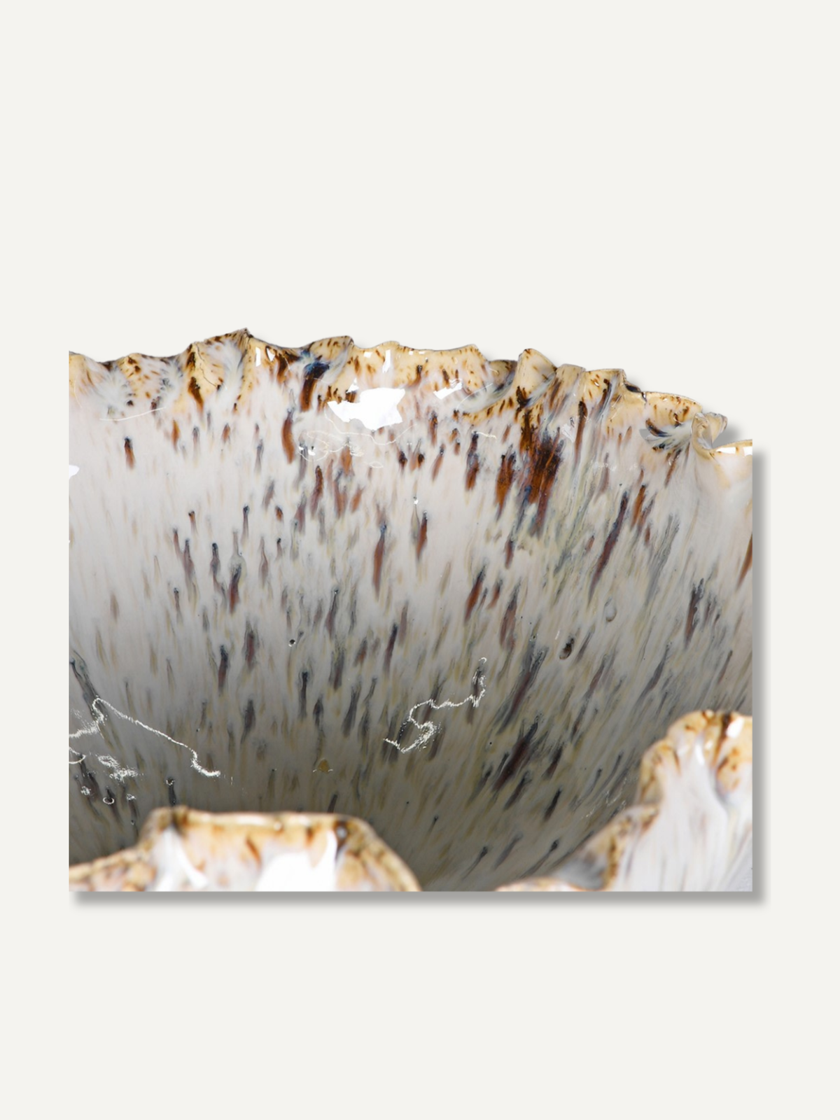 up close of reactive speckled glazed bowl