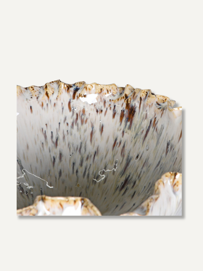 up close of reactive speckled glazed bowl