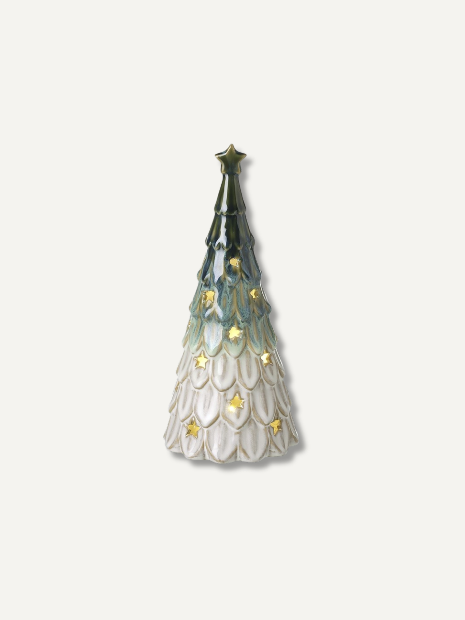 A large decorative Christmas tree figurine with a dark green to light blue gradient upper section, a white textured lower section, and small gold star accents, shown on a plain light background.