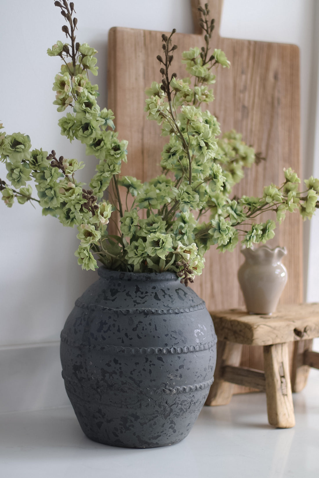 dark charcoal ridged terracotta vase with faux green hops stems