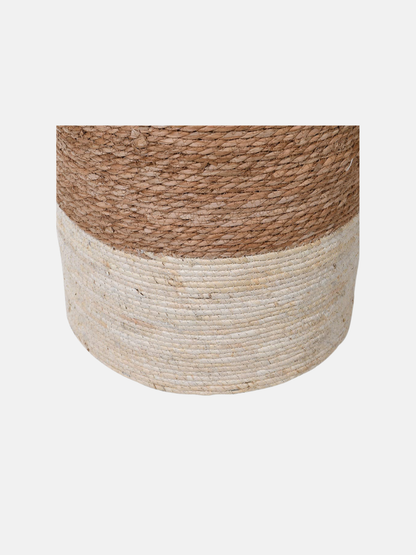 Woven drum stool with two-tone design on a light gray background