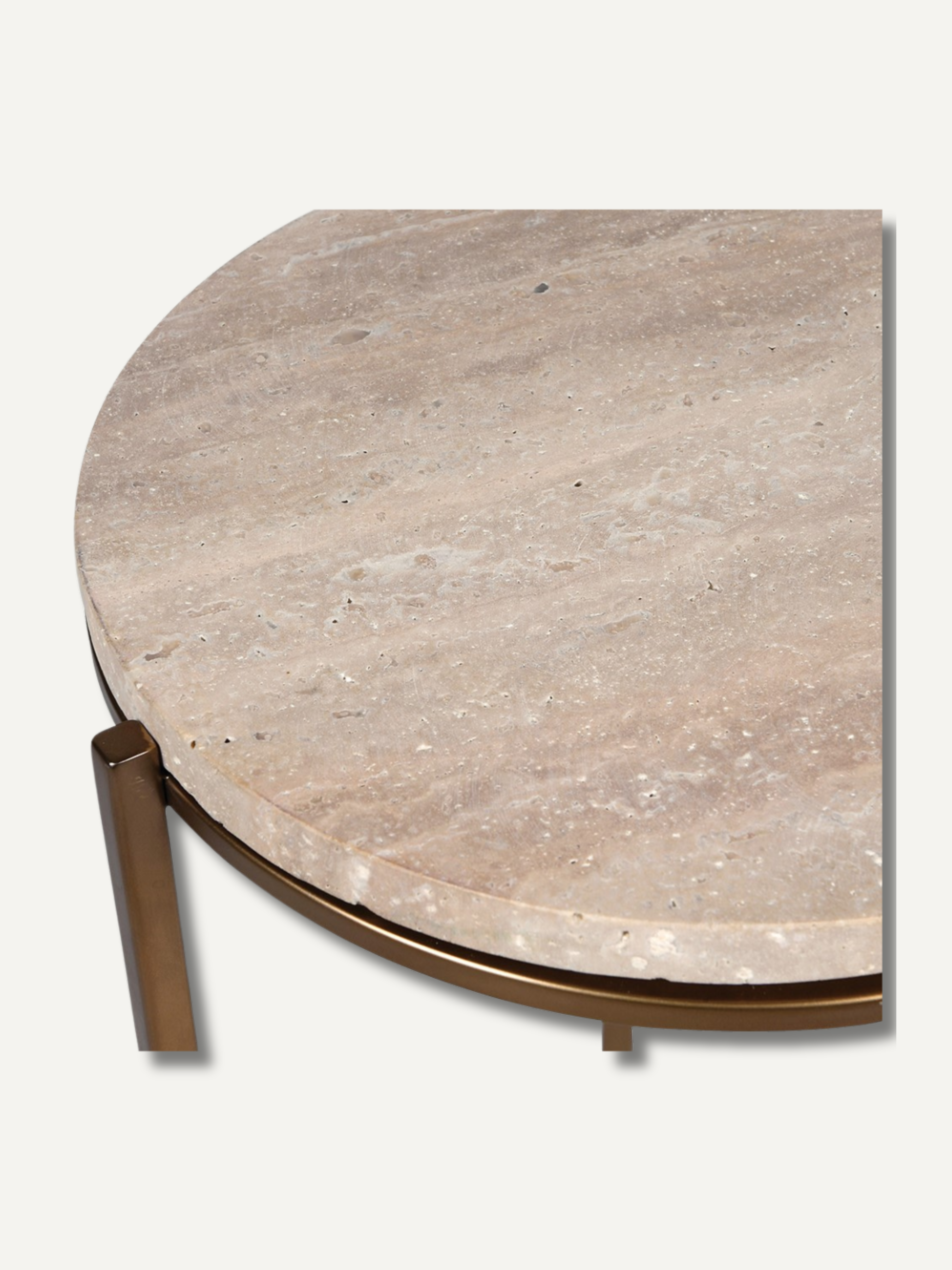 Round travertine table with bronze base on a white background