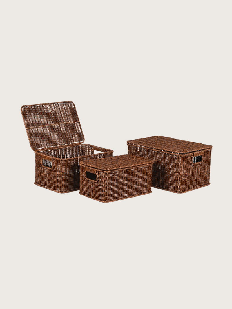 Set of wicker storage baskets on a beige background