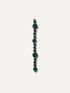A single strand of dark green bobble beads garland with subtle red edges, arranged vertically against a solid off-white background.