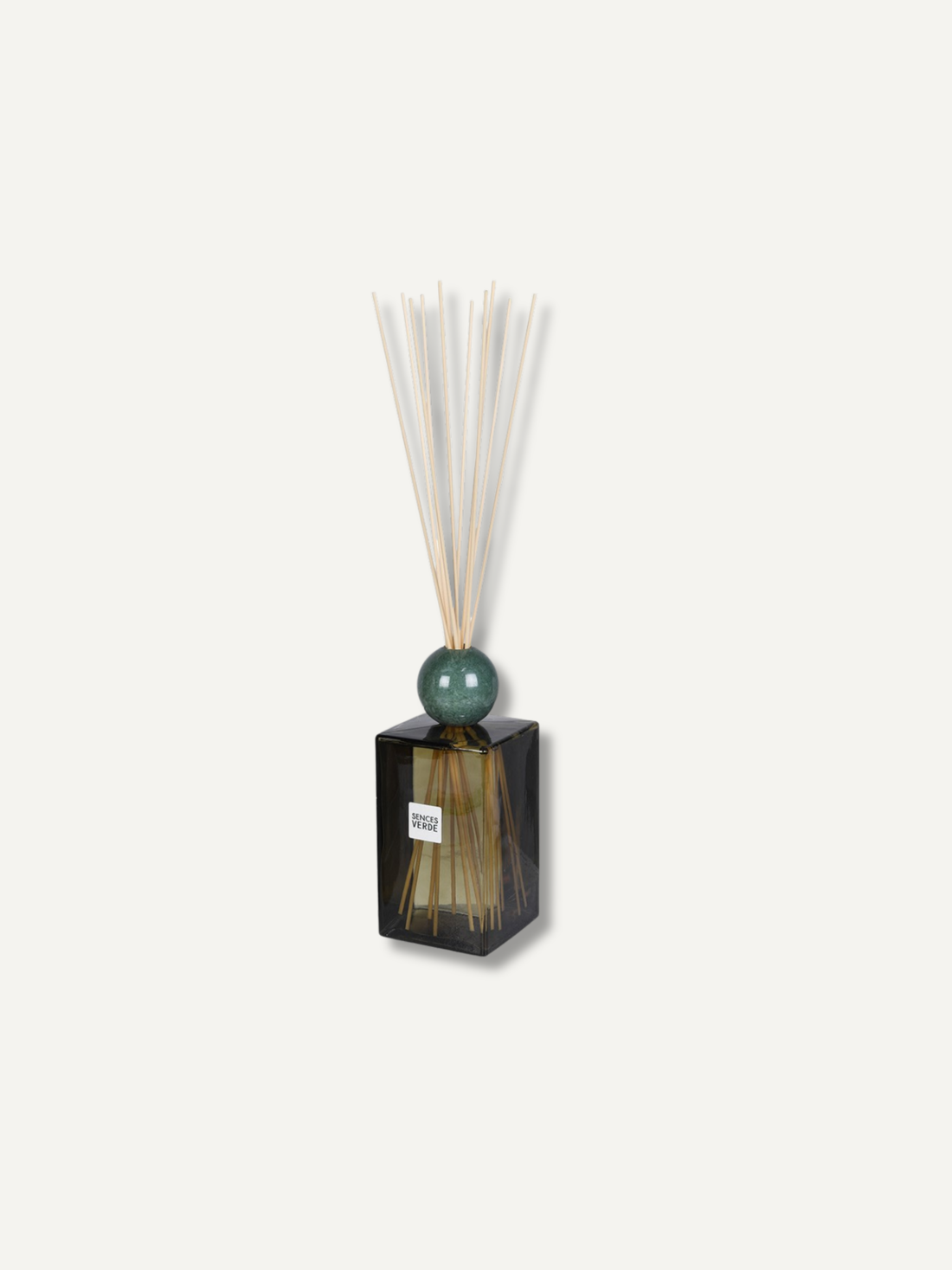 dark green statement glass reed diffuser with green marble round top and natural wooden reeds