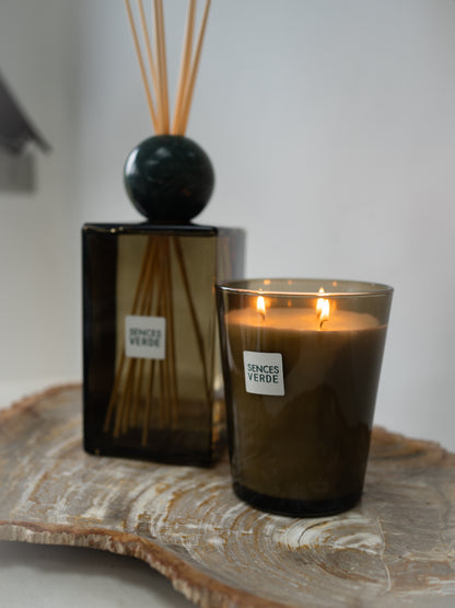 Lit green glass large scented candle and statement extra large reed diffuser with green marble round stopper
