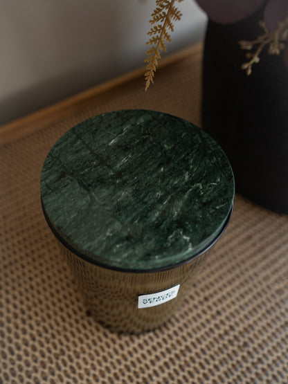 Green marble lid on glass candle