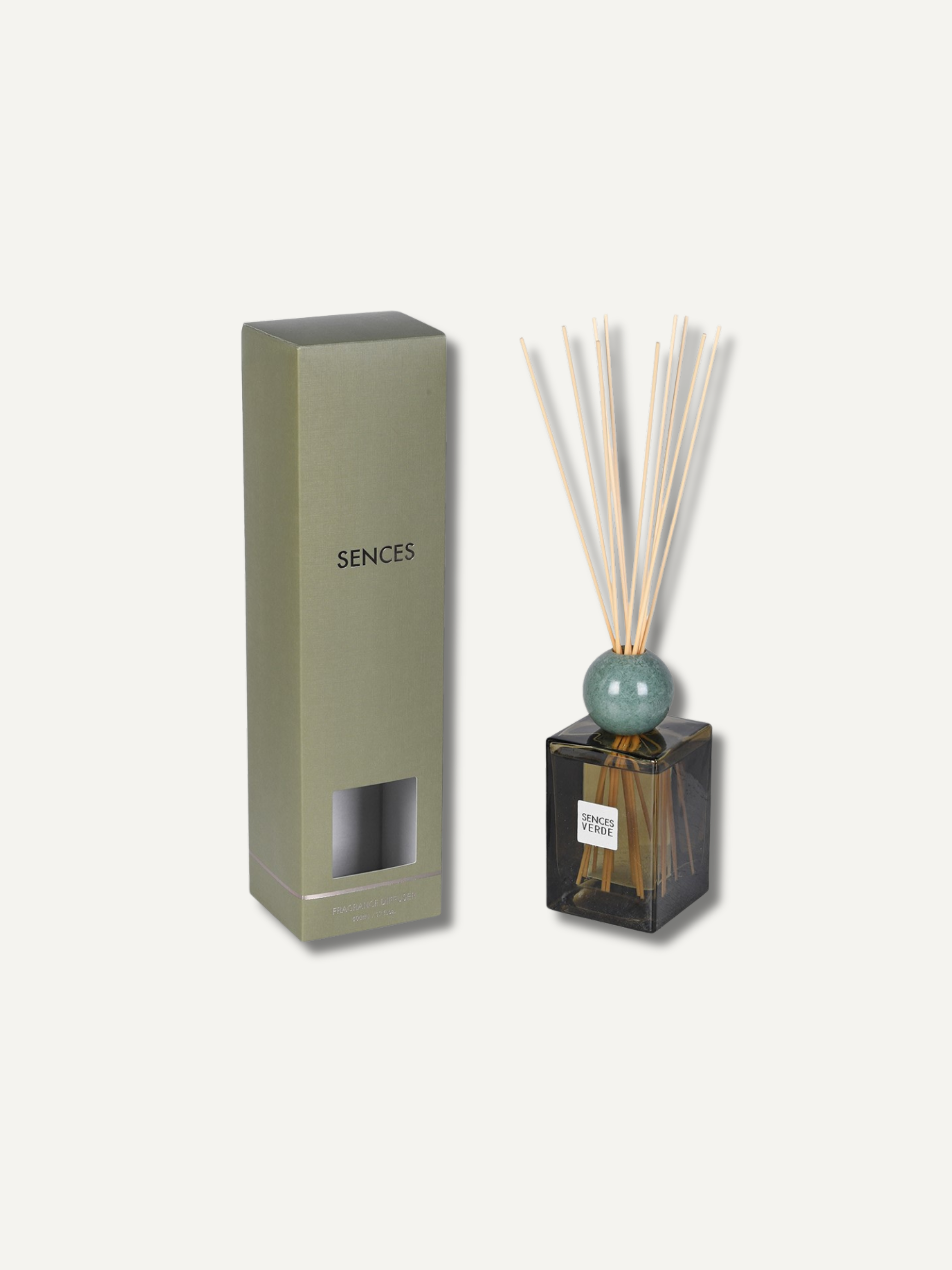 A reed diffuser set with a tall olive green rectangular box labeled &
