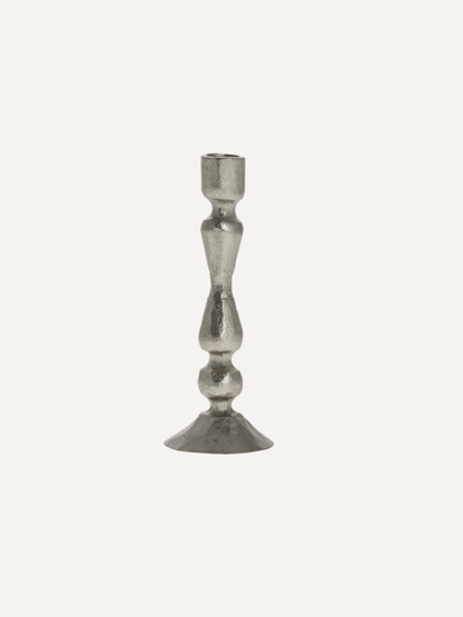 Silver candle stick on a white background
