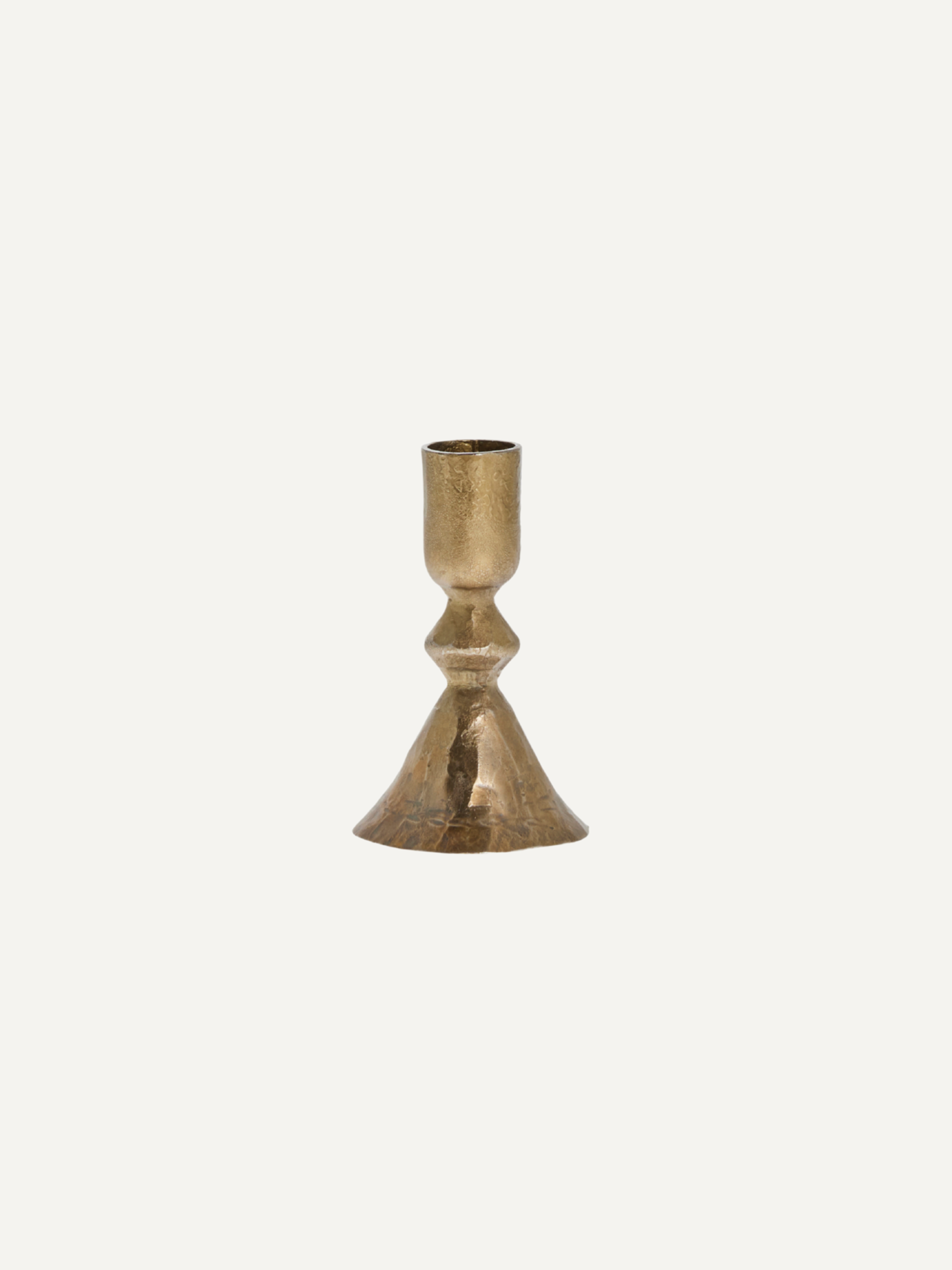 Gold metal vintage style candlestick on a white background