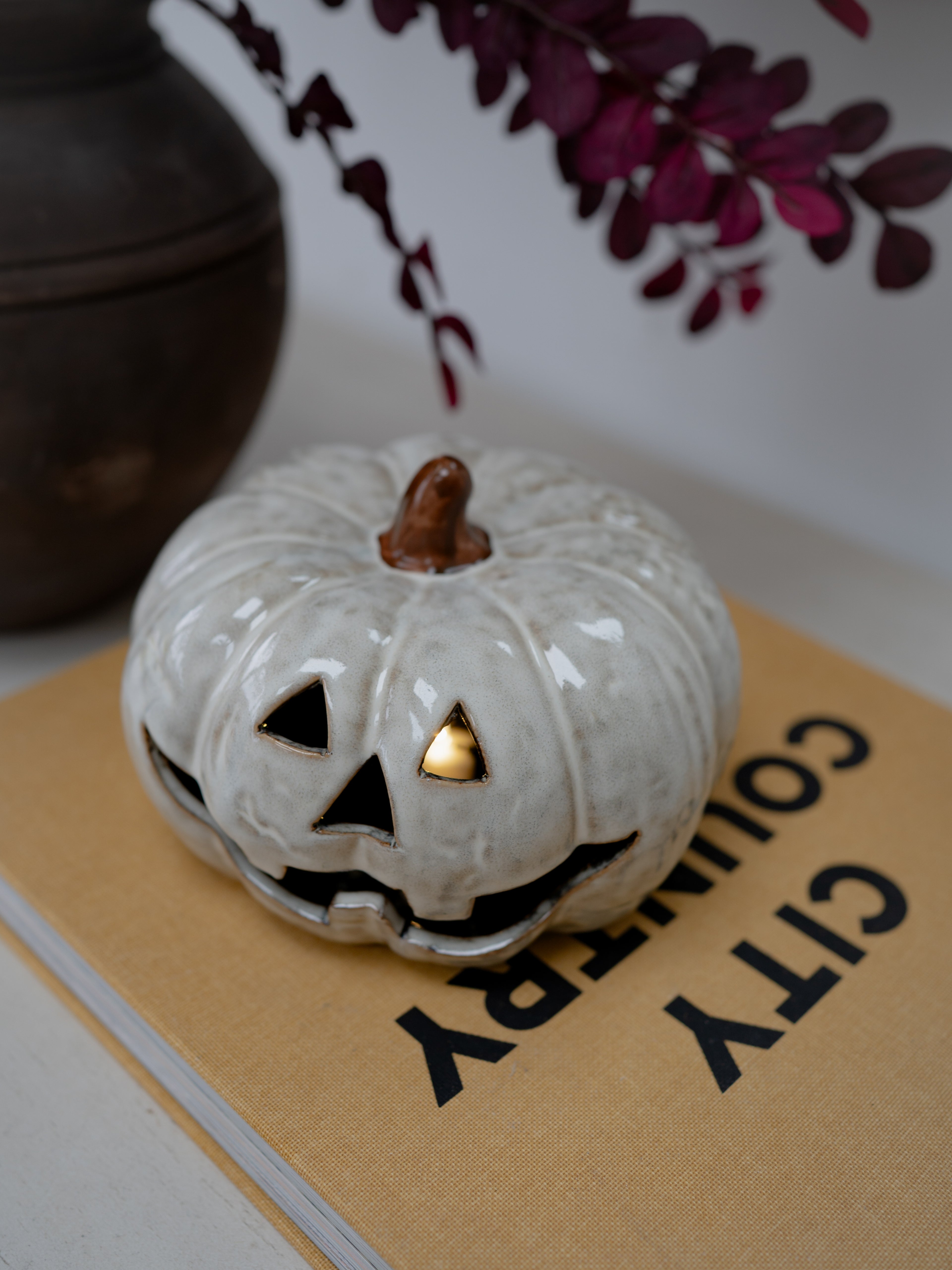 A white glazed ceramic jack-o&