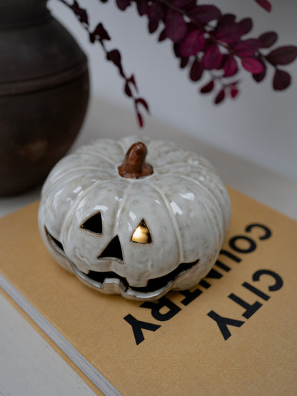 A white glazed ceramic jack-o&