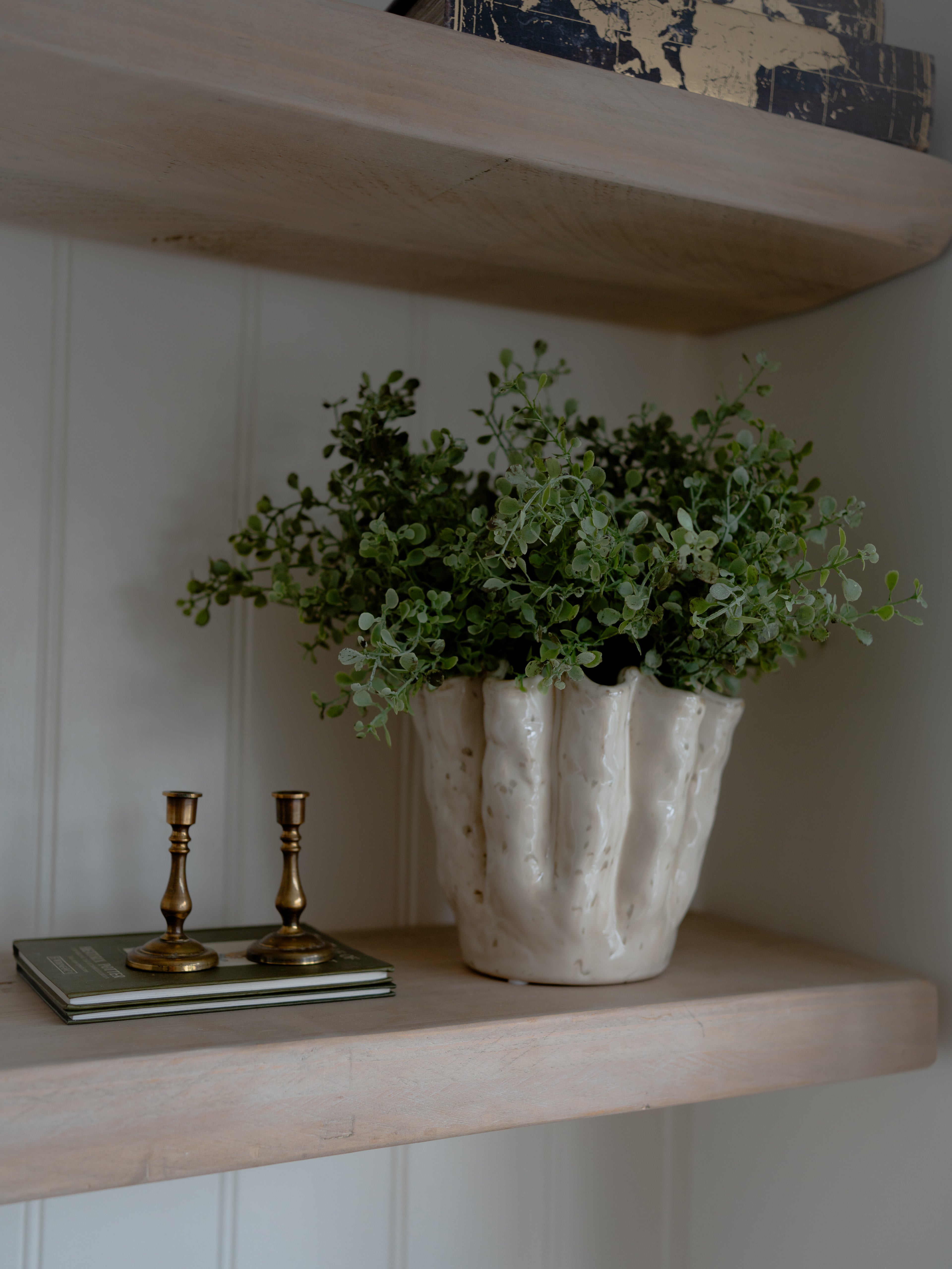 White Stoneware Wavy Planter filled with faux gunnii eucalyptus bushes