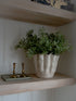 White Stoneware Wavy Planter filled with faux gunnii eucalyptus bushes