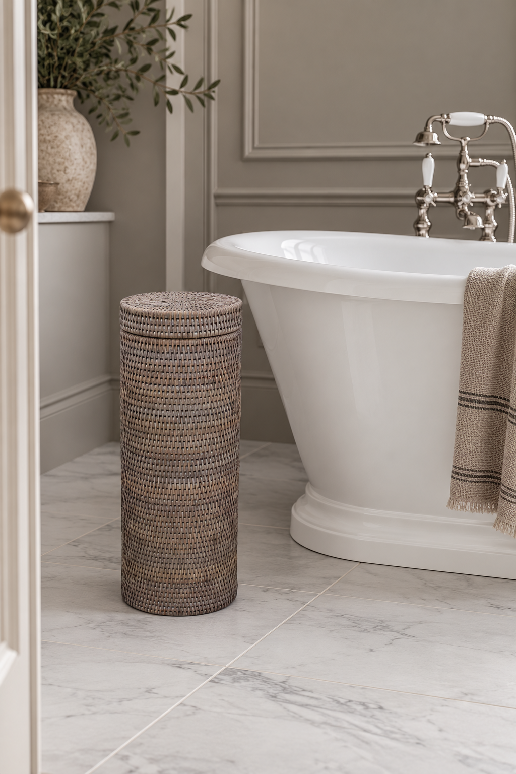 White Washed Rattan Toilet Roll Holder in elegant modern bathroom